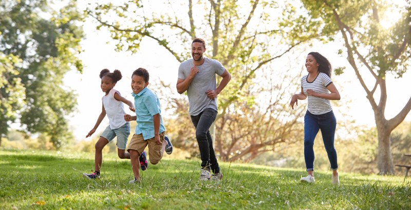 Happy active family outdoors showcasing a healthy lifestyle