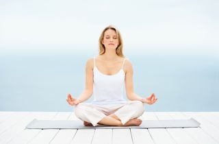 Person meditating calmly, representing stress relief from Intervene Herbal